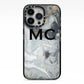 Monogram Black White Swirl Marble iPhone 13 Pro Black Impact Case on Silver phone