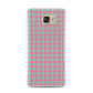 Pink Houndstooth Samsung Galaxy A7 2016 Case on gold phone