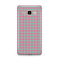 Pink Houndstooth Samsung Galaxy J7 2016 Case on gold phone