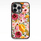 Pink and Mustard Floral iPhone 13 Pro Black Impact Case on Silver phone