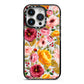 Pink and Mustard Floral iPhone 14 Pro Black Impact Case on Silver phone